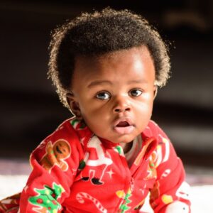 Baby in red Christmas onsie